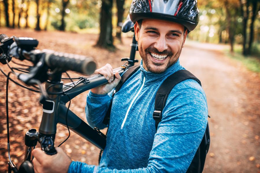 Man Biking on Paths