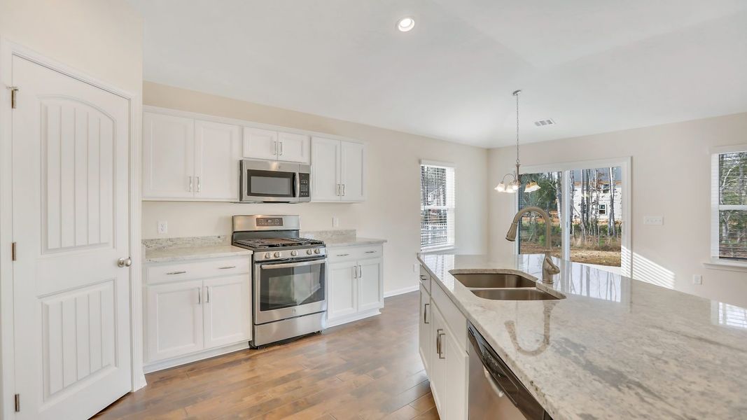 Furnished interior in a model home at Woodland Cove in Brunswick (Image 4).