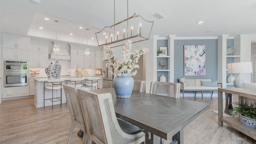 Furnished interior in a model home at The Courtyards at Redbud Lane in Holly Springs (Image 22).