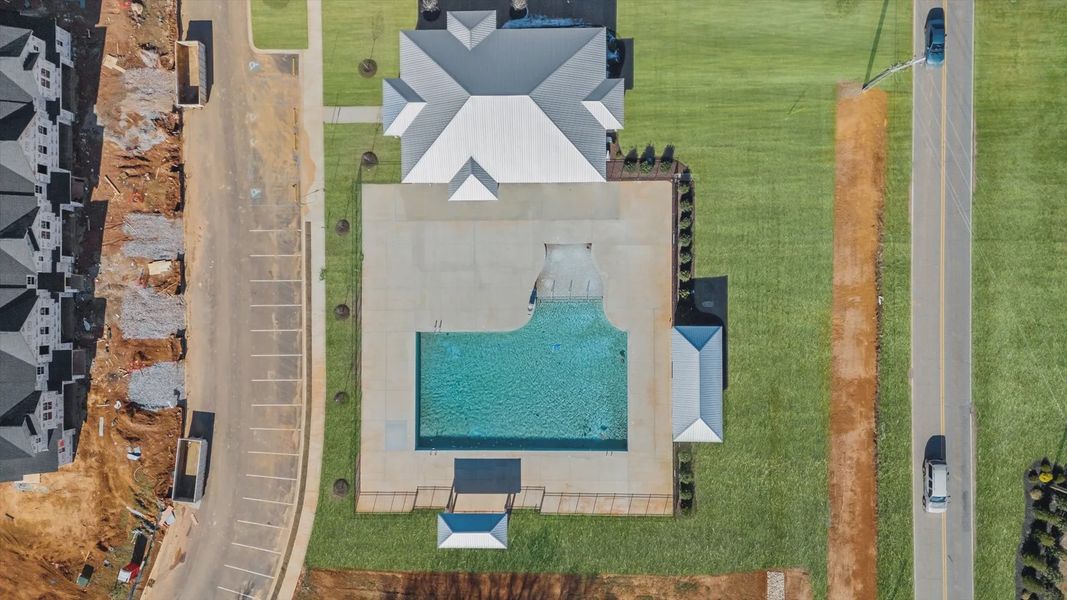 Large amenities center including resort style swimming pool at Village at Midway by DRB Homes Large amenities center including resort style swimming pool at Village at Midway by DRB Homes