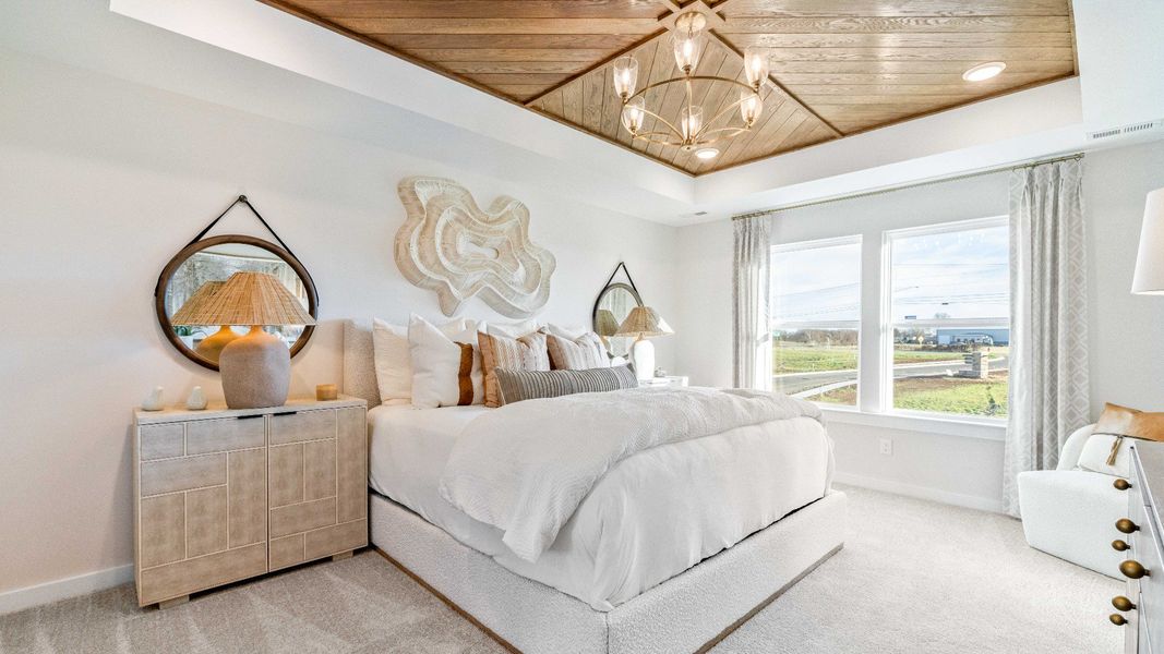 Come home to your welcoming primary suite with large windows and attractive finishes