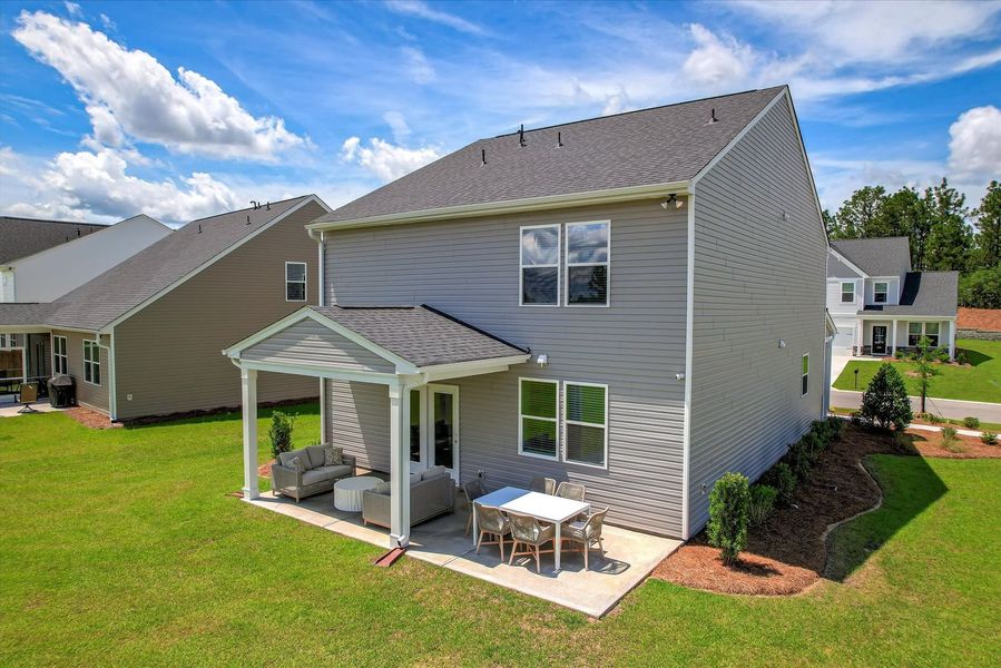 Extend your living space outdoors with a spacious covered patio