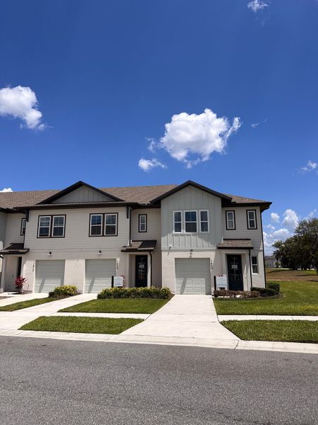 Front exterior of a home in the The Enclaves at Festival Cove community, located in Davenport, FL (Image 8).