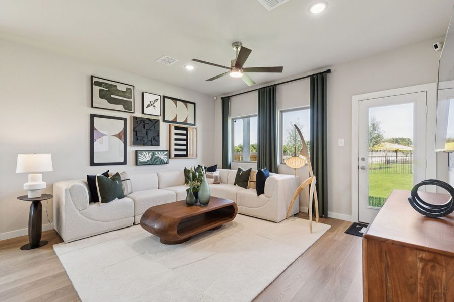 Living Room in a Lowry Trails New Magnolia Model in Princeton TX by Trophy Signature Homes