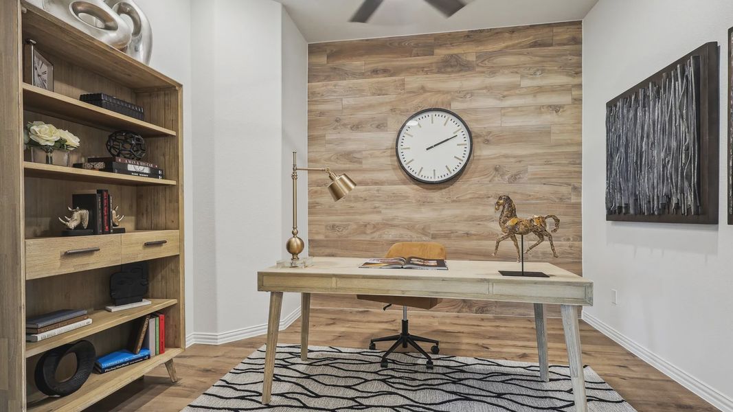 Refined Churchill office features a rich wood accent wall and exquisite modern decor. Luxurious and inviting. Refined Churchill office features a rich wood accent wall and exquisite modern decor. Luxurious and inviting.