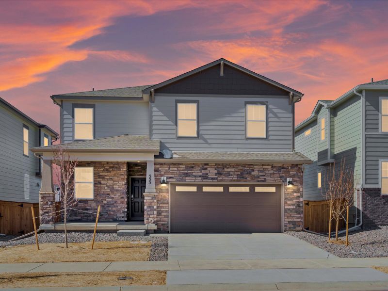 Front exterior of a home in the Ridgeline Vista: The Flora Collection community, located in Brighton, CO (Image 1).