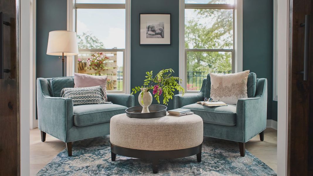 Furnished interior in a model home at The Courtyards at Bailey Farms in Dacula (Image 22).