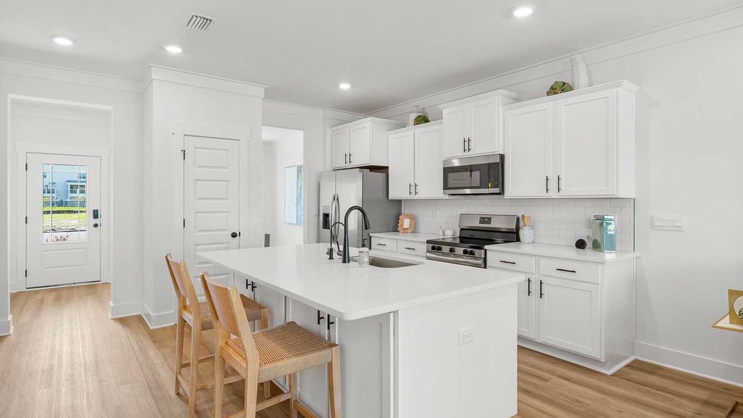 Furnished interior in a model home at Colonial East in Panama City Beach (Image 7).