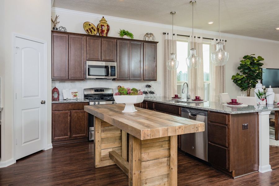 Furnished interior in a model home at Vintage Farms in Brenham (Image 3).