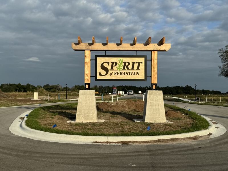 Entrance to the Spirit Of Sebastian community in Sebastian, FL, featuring signage and landscaping (Image 1).