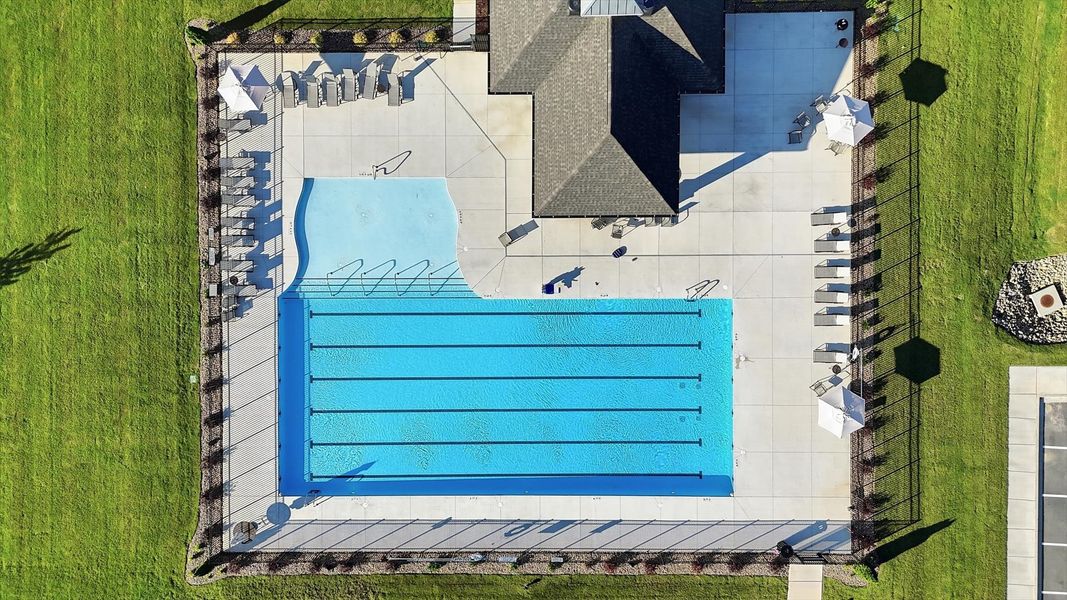 Beautiful community pool at Harrier Point with neighborhood clubhouse and outdoor seating in Woodruff, SC