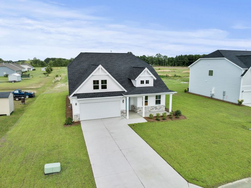 Front exterior of a home in the Pandora's Path community, located in Florence, SC (Image 1). Front exterior of a home in the Pandora's Path community, located in Florence, SC (Image 1).