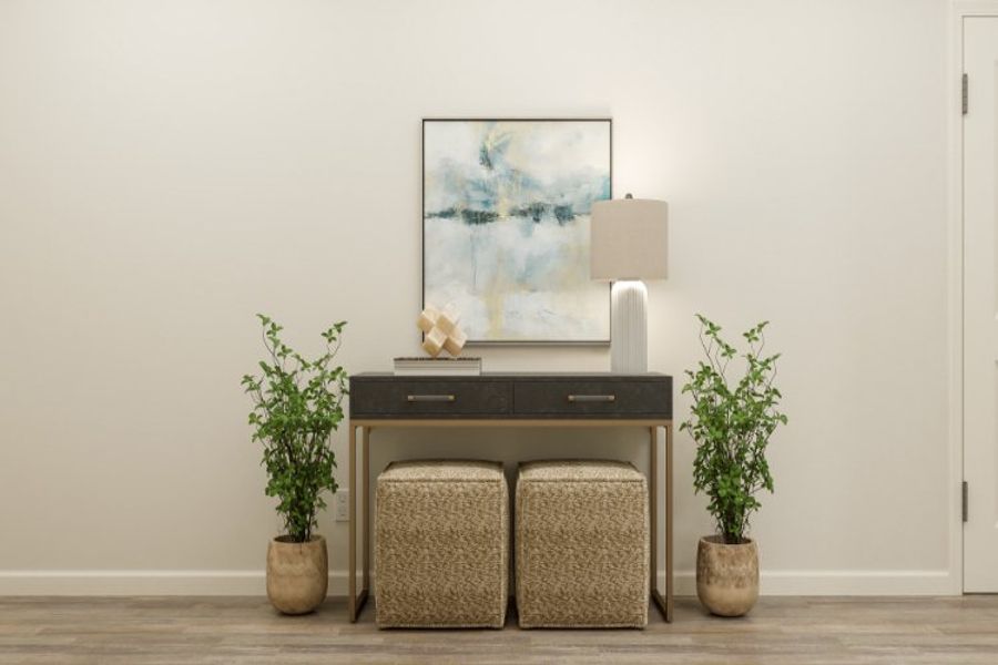 A desk with a plant and a chair in front of it. A desk with a plant and a chair in front of it.