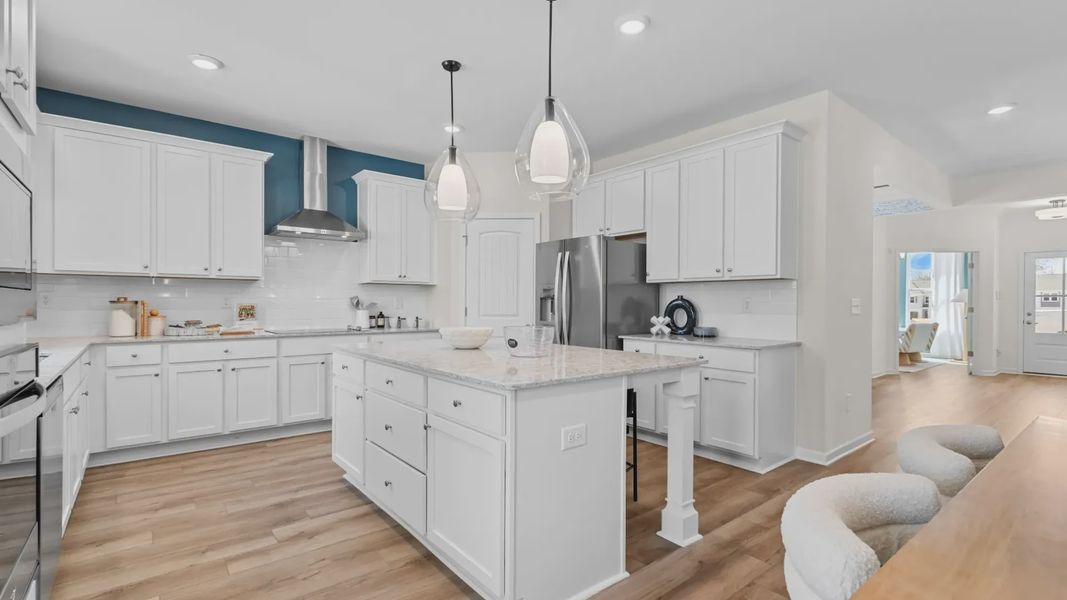 Open-concept kitchen with island, perfect for cooking, dining, and entertaining. Open-concept kitchen with island, perfect for cooking, dining, and entertaining.