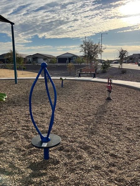 A charming playground with modern play equipment in Canyon Views by Starlight Homes (Litchfield Park, AZ).