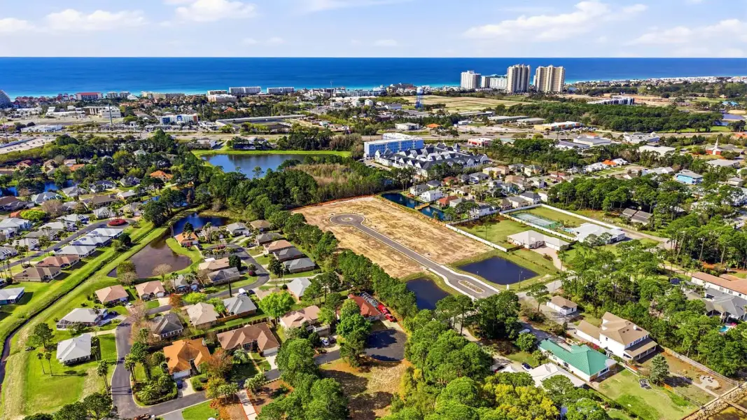 Aerial view of the Crest Bay Cottages community in Miramar Beach, FL, showing layout and nearby surroundings (Image 13). Aerial view of the Crest Bay Cottages community in Miramar Beach, FL, showing layout and nearby surroundings (Image 13).