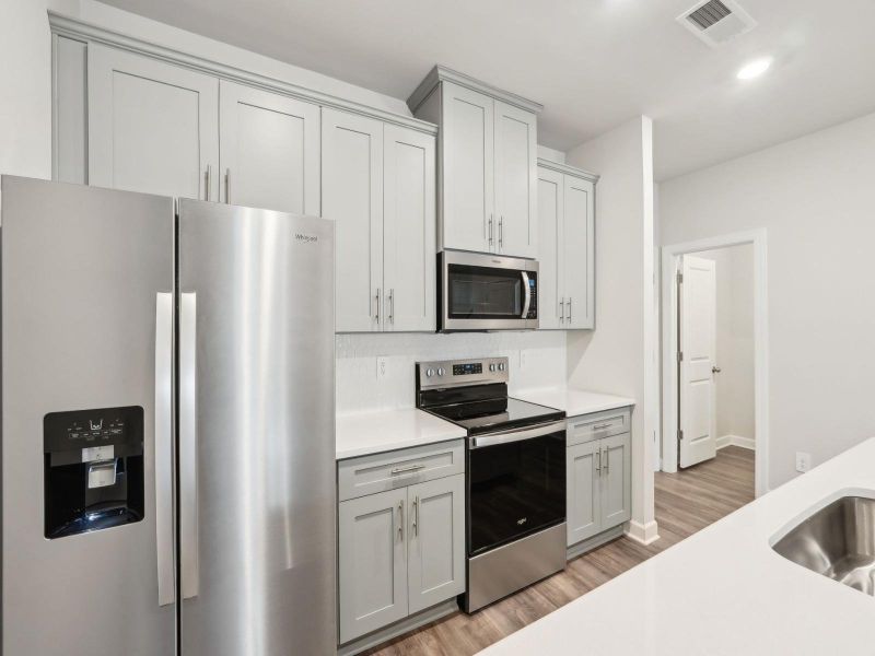 Furnished interior in a model home at Crossrail Station in Mooresville (Image 7).
