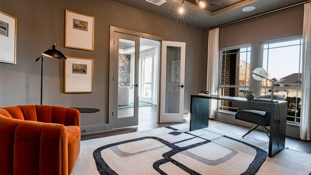 Furnished interior in a model home at Woodcreek in Rowlett (Image 6).