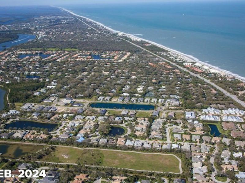 Aerial view of the The Strand community in Vero Beach, FL, showing layout and nearby surroundings (Image 12).