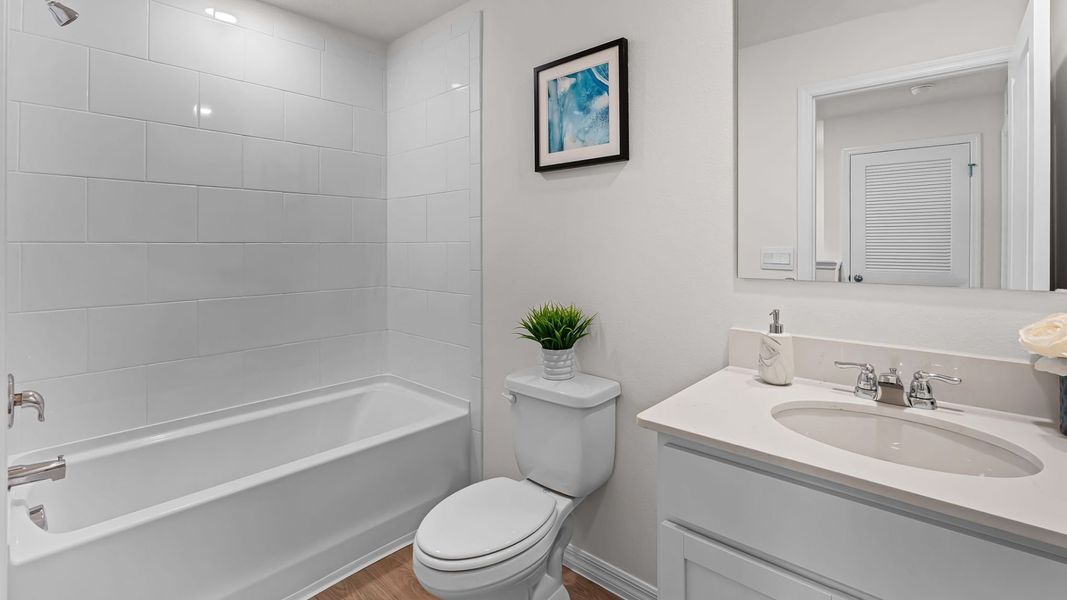 Furnished interior in a model home at Evergreen Park in Kissimmee (Image 19).