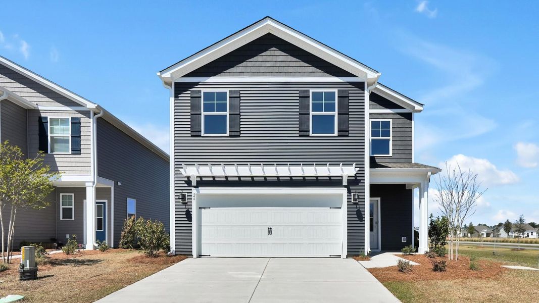 Front exterior of a home in the The Pines at Blake Farm community, located in Wilmington, NC (Image 5).