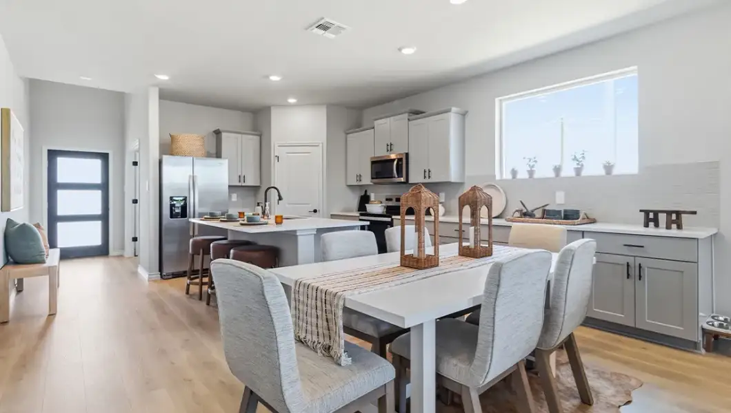 Furnished interior in a model home at The Woodlands at Medina Hills in Mico (Image 15).