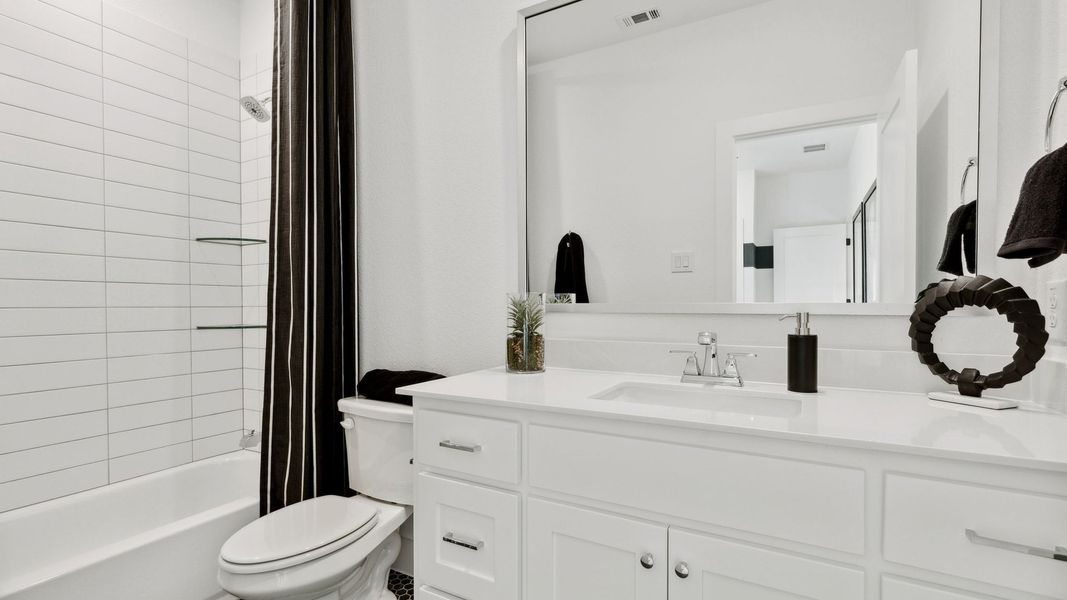 Furnished interior in a model home at Windsong Ranch 71' Series in Prosper (Image 54).