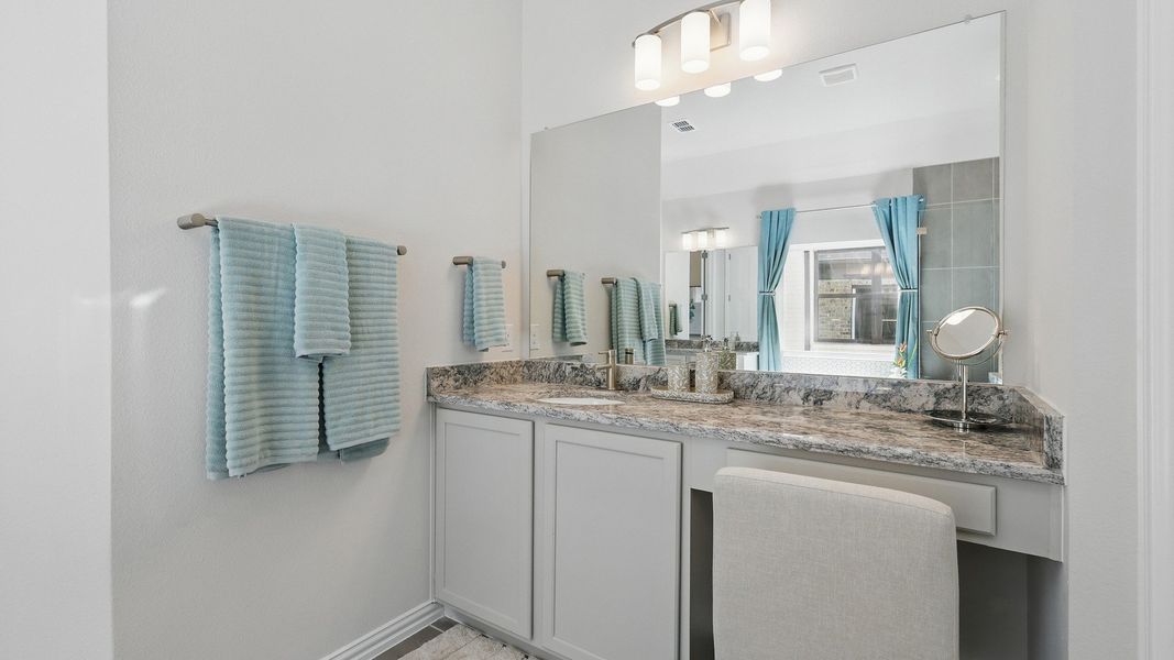 Experience luxury with a marble vanity, sleek light fixtures, and refined fittings in Green Oaks Preserve. Experience luxury with a marble vanity, sleek light fixtures, and refined fittings in Green Oaks Preserve.