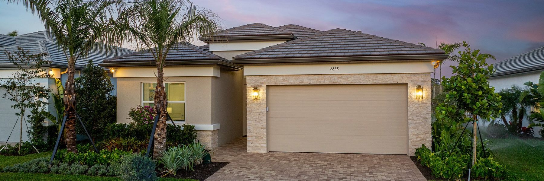 Front exterior of a home in the Valencia Sky (55+) community, located in Naples, FL (Image 4).