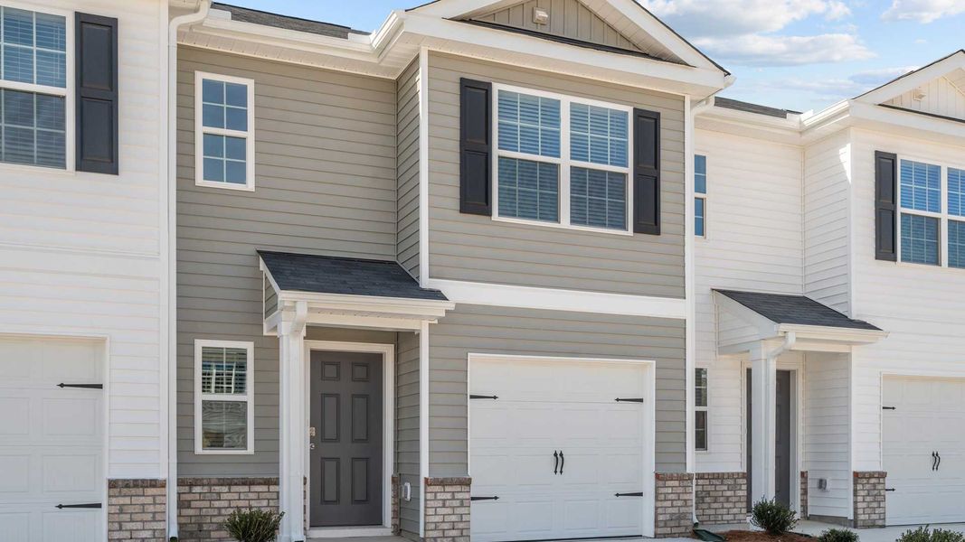 Front exterior of a home in the The Townes at Carter Ridge community, located in Greenville, NC (Image 3).