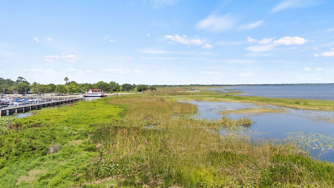 Aerial view of St. Cloud Marina with boat docks and scenic Lake Tohopekaliga shoreline near Cyrene at Harmony. Aerial view of St. Cloud Marina with boat docks and scenic Lake Tohopekaliga shoreline near Cyrene at Harmony.