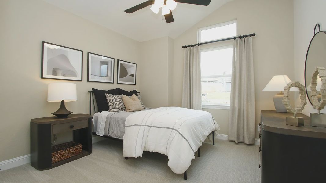 Discover minimalist elegance with high ceilings and sophisticated art in The Woodlands Hills.