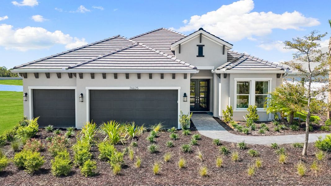 Front exterior of a home in the Esplanade at Kingston community, located in Estero, FL (Image 4).