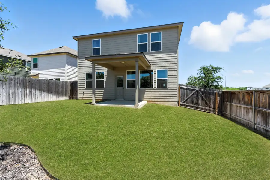 Front exterior of a home in the Blue Ridge Ranch community, located in San Antonio, TX (Image 9).