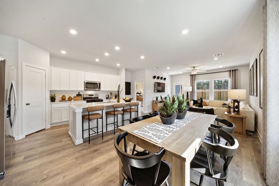 A kitchen with a dining table.
