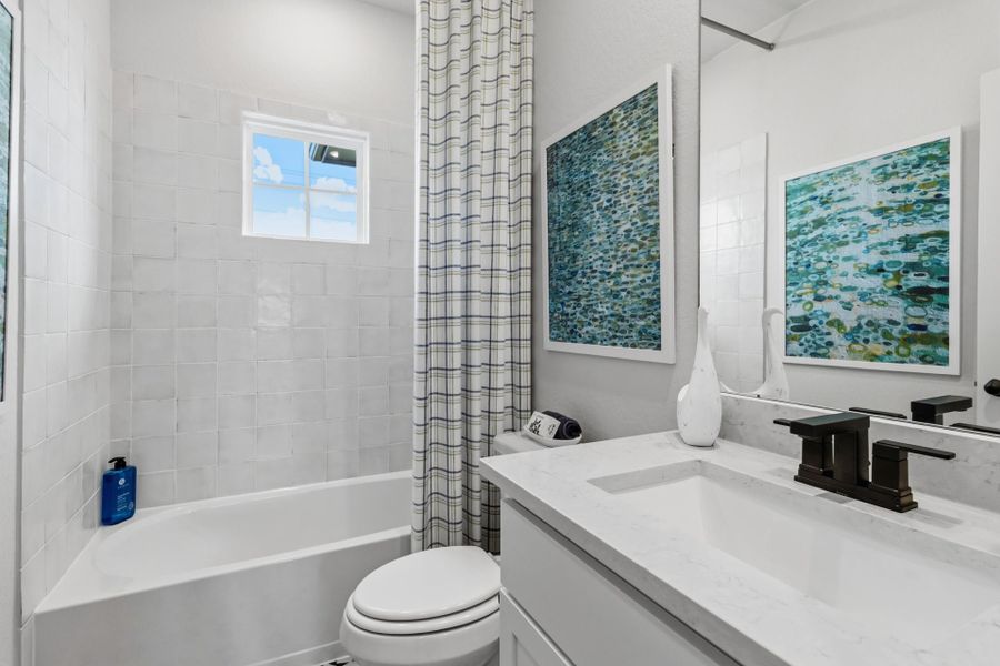 Furnished interior in a model home at Villas Las Flores in Floresville (Image 30).