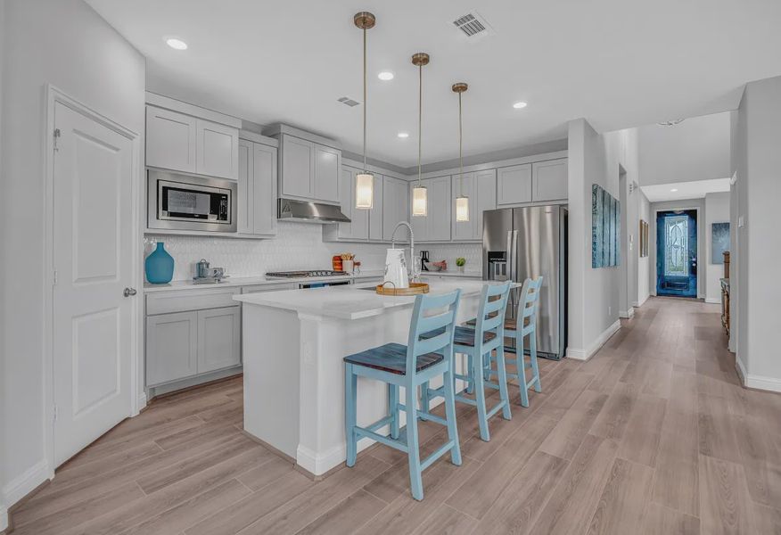 Wood Leaf Reserve model home kitchen - 1 of 8