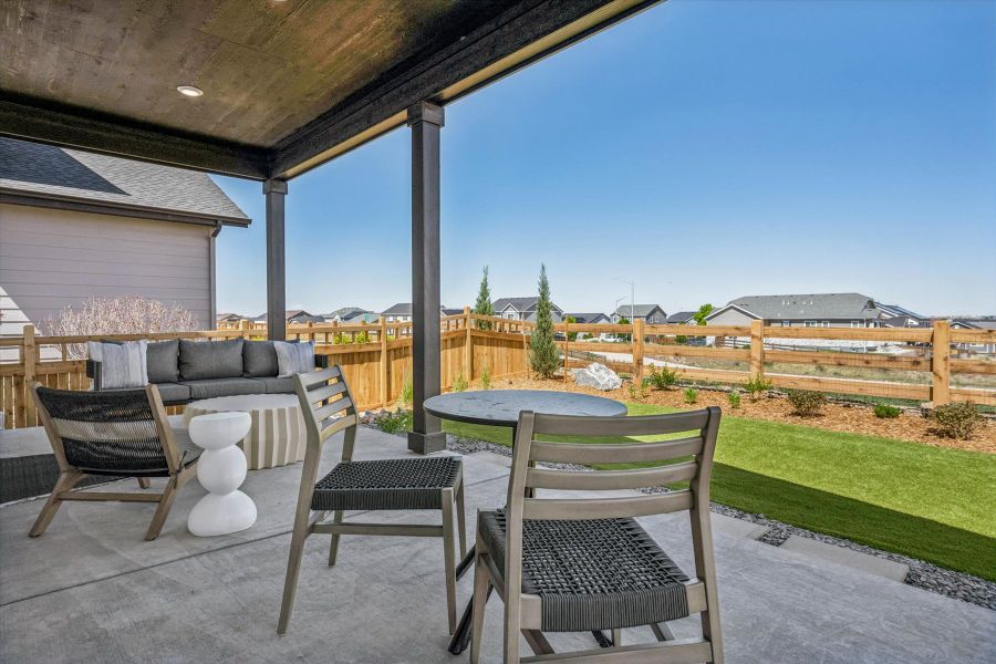 A patio with a table and chairs. A patio with a table and chairs.
