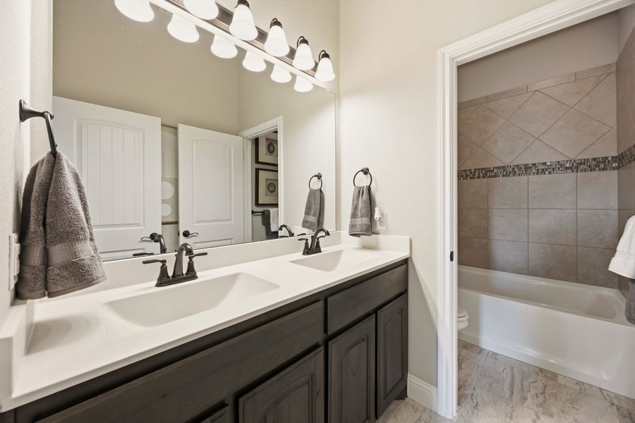 Furnished interior in a model home at Coyote Crossing in Godley (Image 37).