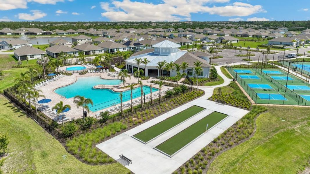 Aerial view of the Coral Bay - Express & Tradition community in North Fort Myers, FL, showing layout and nearby surroundings (Image 1). Aerial view of the Coral Bay - Express & Tradition community in North Fort Myers, FL, showing layout and nearby surroundings (Image 1).