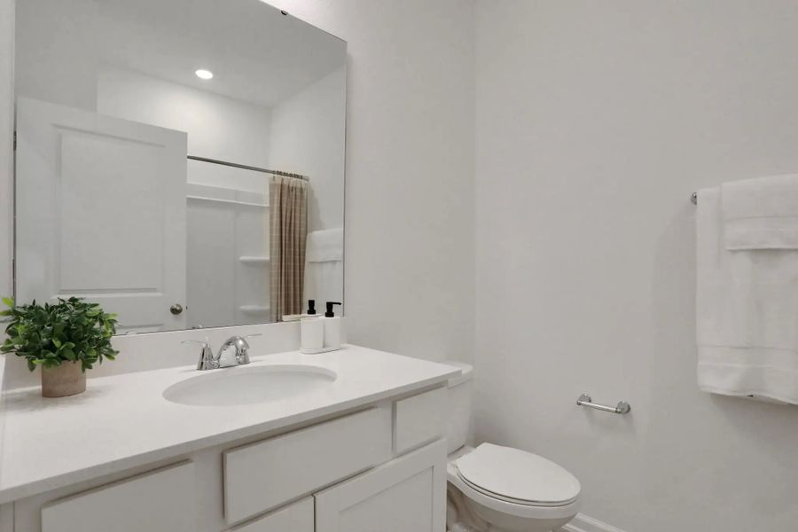 Furnished interior in a model home at Seminole Trace - Villas in Palm Coast (Image 14).