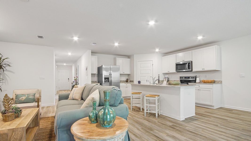 Furnished interior in a model home at Ashton Park Phase III in Freeport (Image 5).