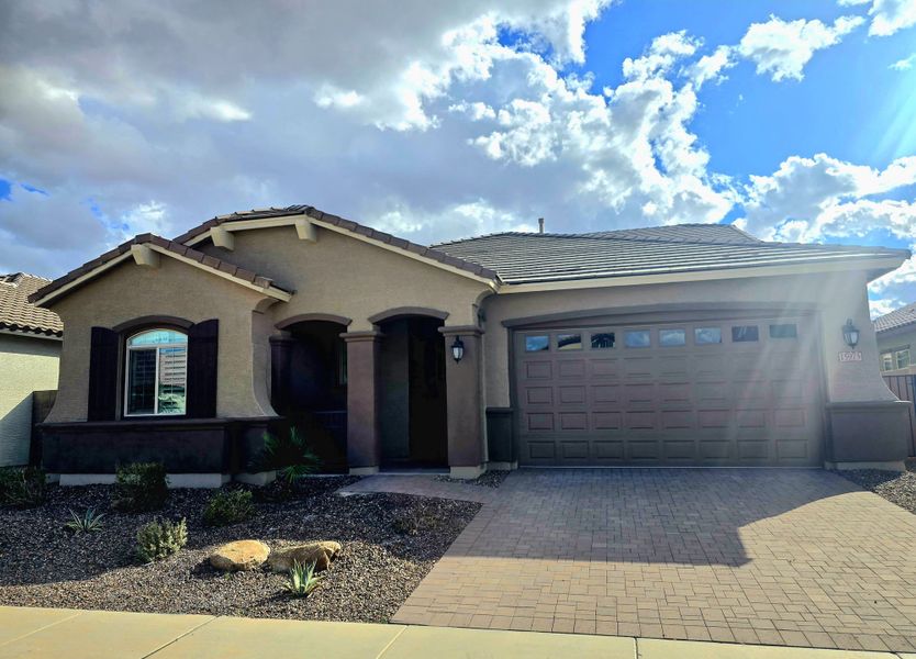 A beautiful home with arched entry and neat landscaping in North Shore at Escalante by Fulton Homes (Surprise, AZ).