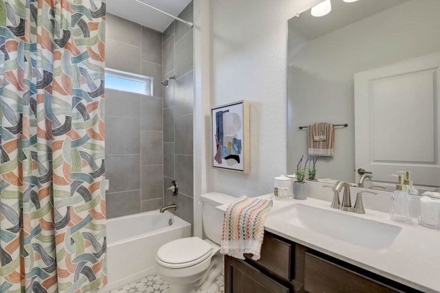 Furnished interior in a model home at Village at Three Oaks in Seguin (Image 11).