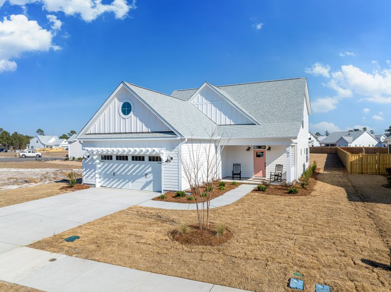 Front exterior of a home in the Songbird community, located in Hampstead, NC (Image 1). Front exterior of a home in the Songbird community, located in Hampstead, NC (Image 1).