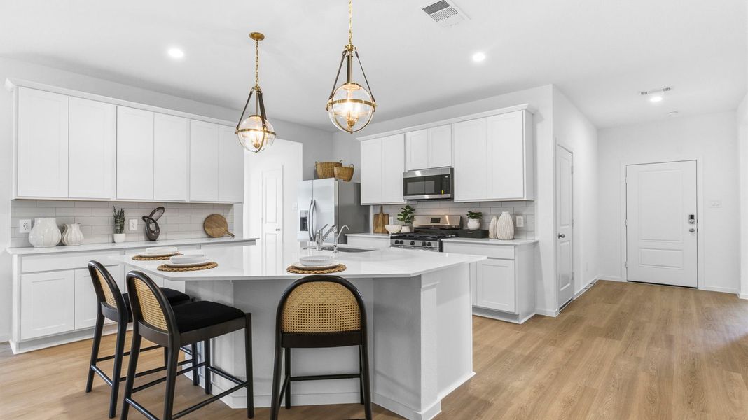 Furnished interior in a model home at Watermark in Alvin (Image 7).