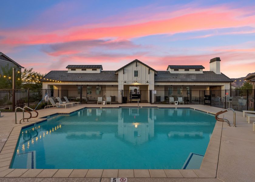 A swimming pool in front of a house. A swimming pool in front of a house.