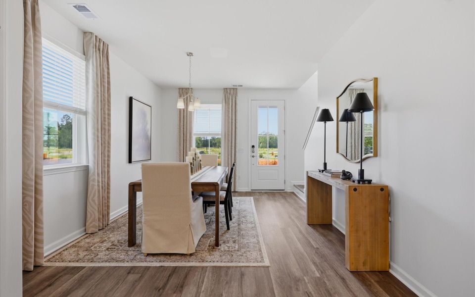 Furnished interior in a model home at Riverwalk Pointe at Mallory Creek - Townhomes in Leland (Image 19). Furnished interior in a model home at Riverwalk Pointe at Mallory Creek - Townhomes in Leland (Image 19).