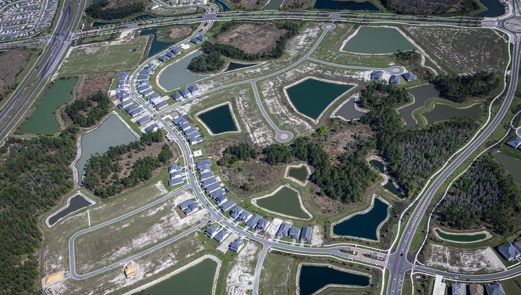 Aerial view of the Tamarack at Two Rivers community in Zephyrhills, FL, showing layout and nearby surroundings (Image 11).