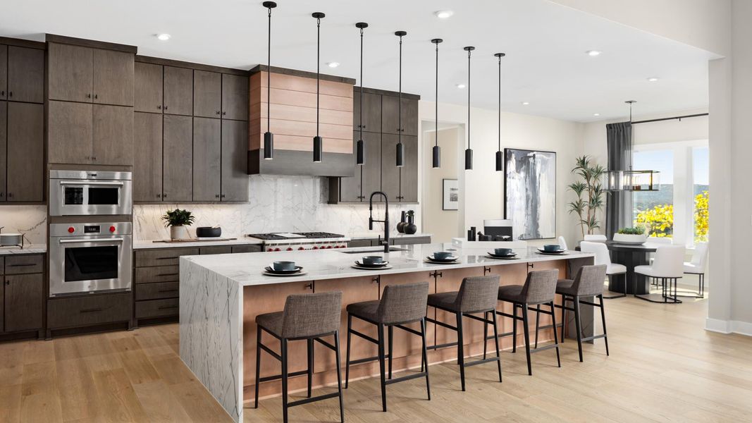 Gourmet kitchens boasts a large center island and stainless steel appliances Gourmet kitchens boasts a large center island and stainless steel appliances